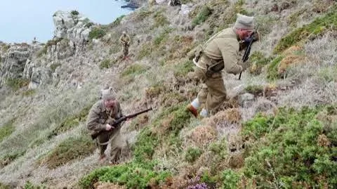 A costumed re-enactment of commandos climbing the Hogsback on Sark