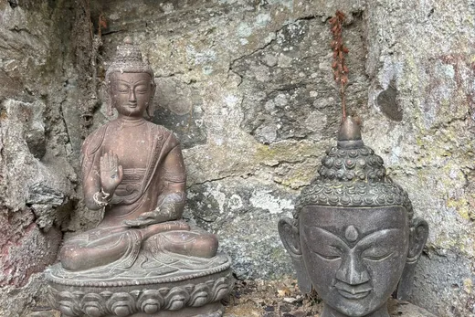 Buddha statue in the garden of the retreat house on Sark