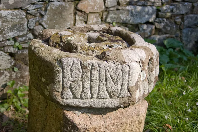 A circular carved stone set on a stone pillar, Sark, Channel Islands