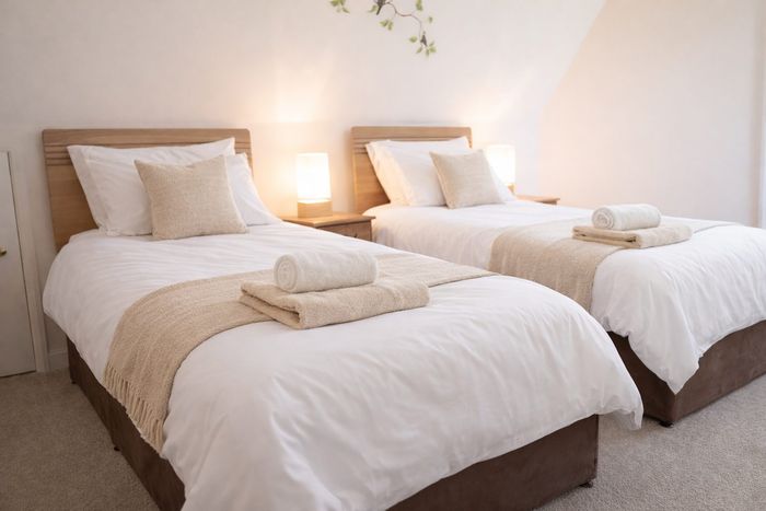 The Coastal Rose twin bedroom at the retreat house on Sark