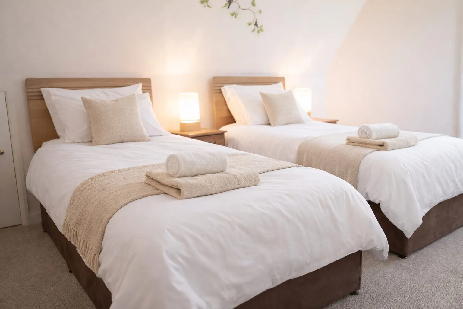 A twin room with two single beds and morning light at the retreat house on Sark, Channel Islands