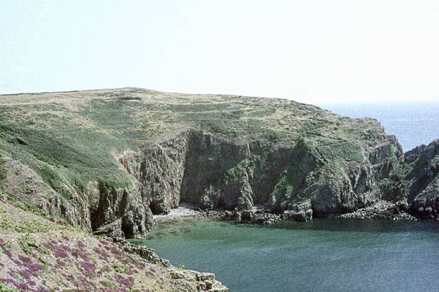 A wild clifftop view over a cove on Sark