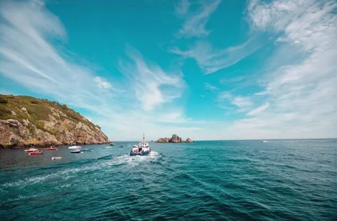 The passenger ferry crossing a bright blue sea to Sark, Channel Islands