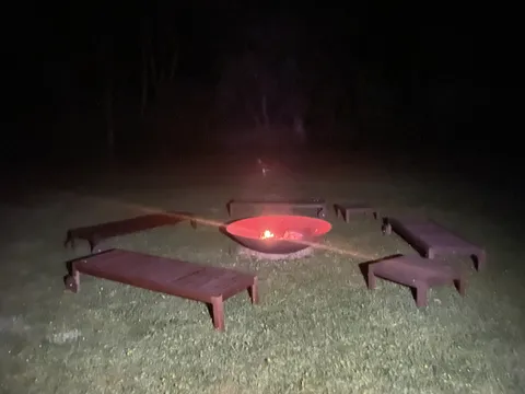 A fire pit glowing after dark on Sark