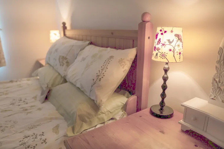 The bedside lamp in the Foxglove room at the retreat house on Sark