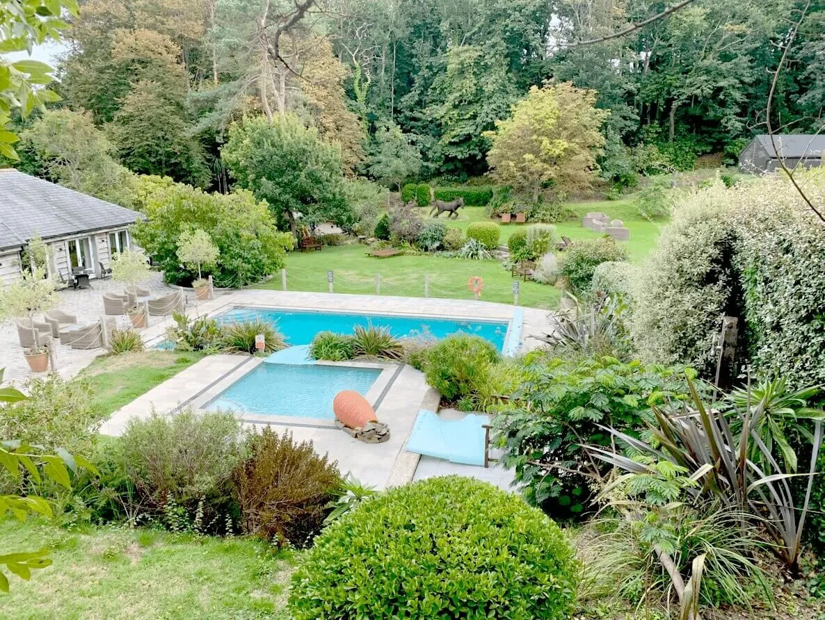 The garden and outdoor pool at the retreat house on Sark