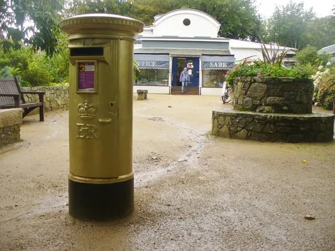 The post office and gold post box on the Avenue, Sark, Channel Islands