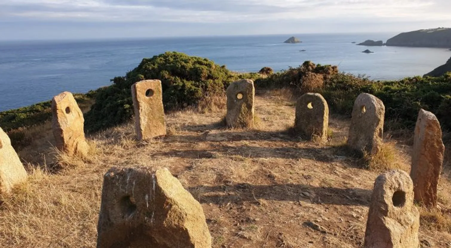Sark Henge standing stones at golden hour above the sea on Sark, Channel Islands