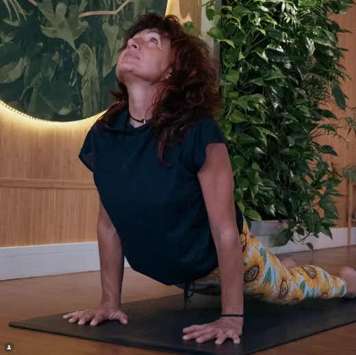 Monica in cobra pose in the yoga studio at the retreat on Sark