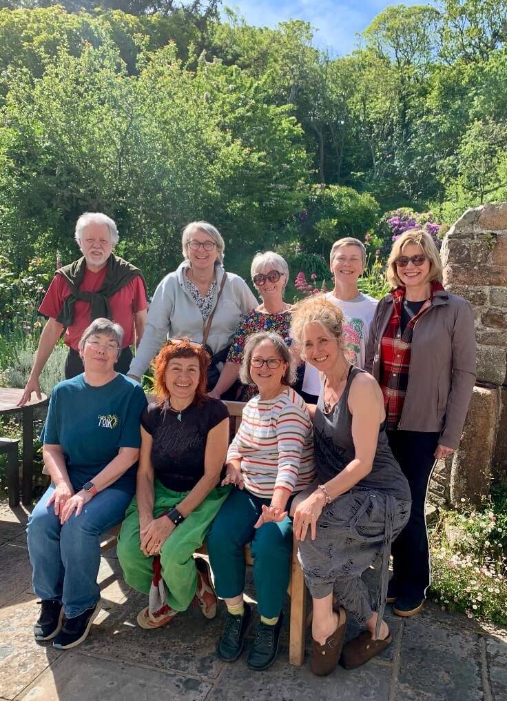 A group of retreat guests together in a garden on Sark