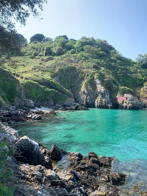 A rocky cove with turquoise water on Sark, Channel Islands