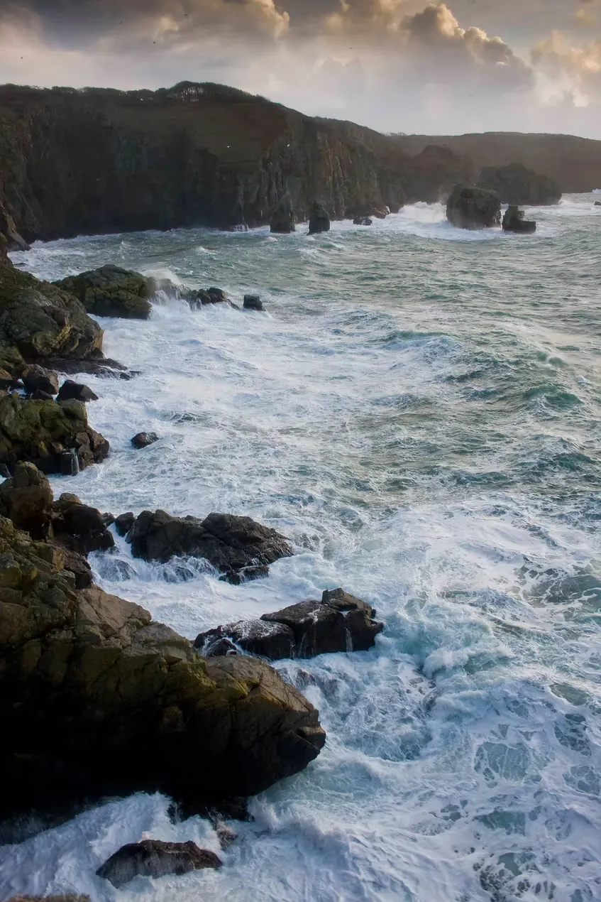 Storm waves breaking against the west coast cliffs of Sark, Channel Islands