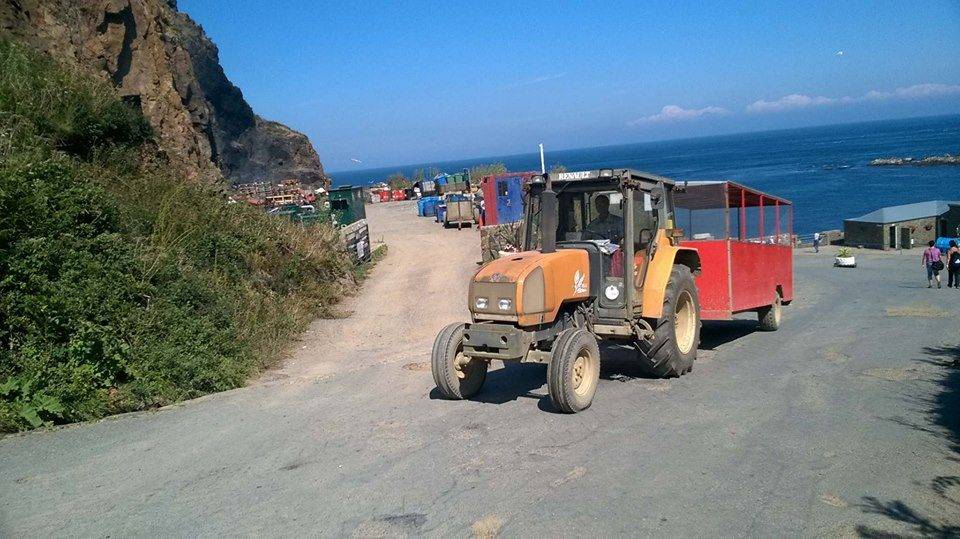 The tractor-drawn toast rack climbing from the harbour on Sark