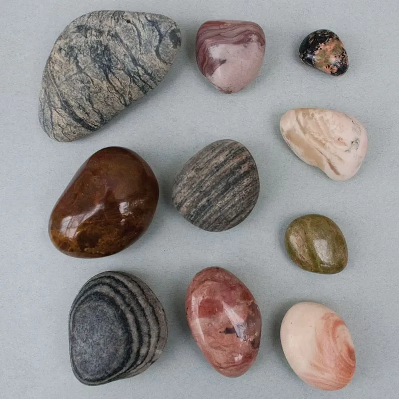 Ten tumbled and polished stones in a range of colours and patterns from Sark, Channel Islands