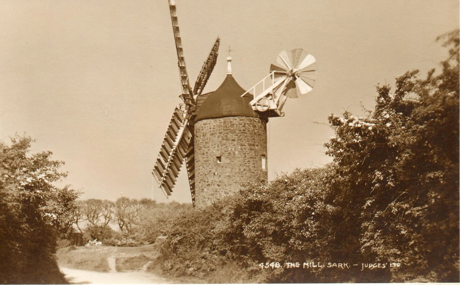 The Sark windmill with its sails and fantail still fitted, photographed about 1914, Sark, Channel Islands